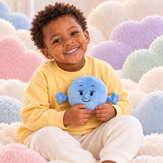 Child holding the accurately sized Sky Friends Moon cuddle plush among soft pastel clouds